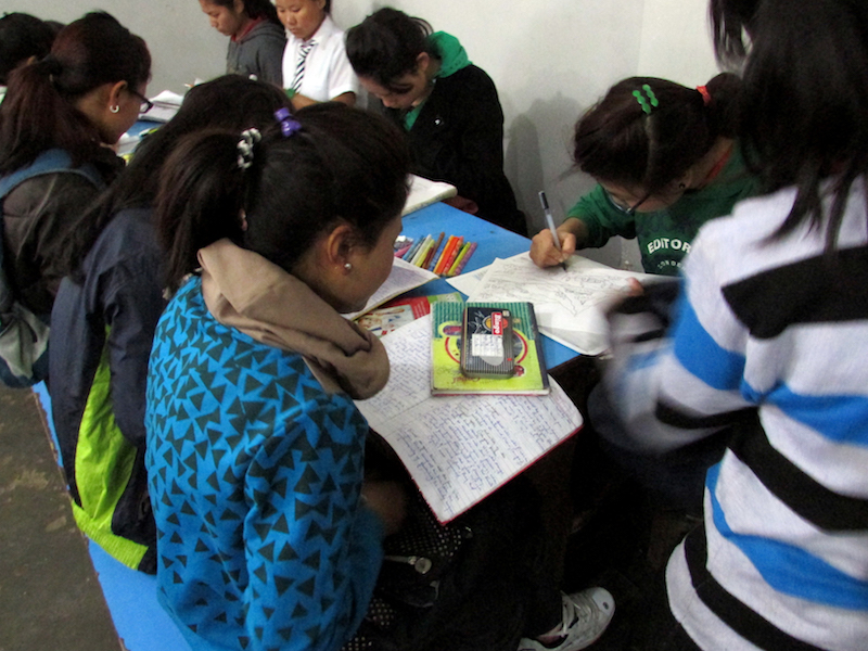 senior children doing self study in dinning hall 1 2